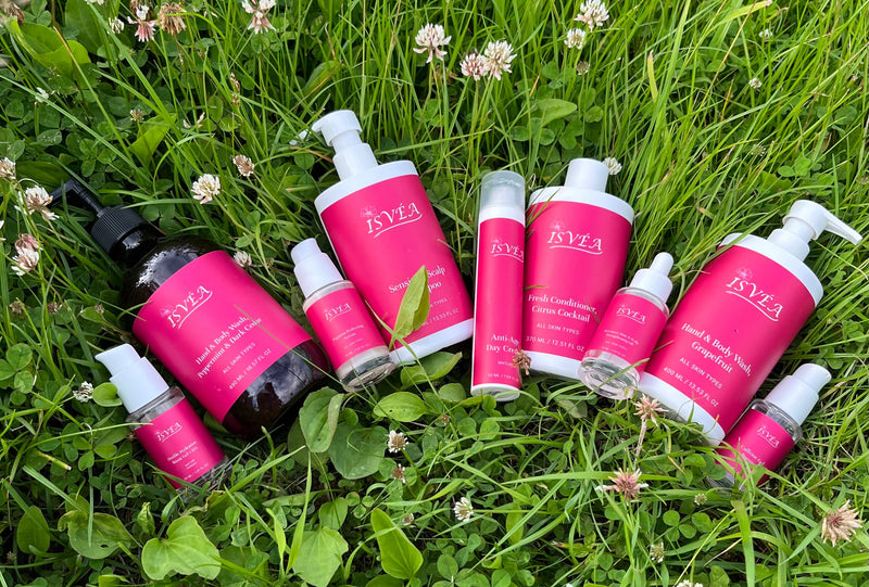ISVEA natural skincare products with COSMOS Natural certified formulas on green grass
